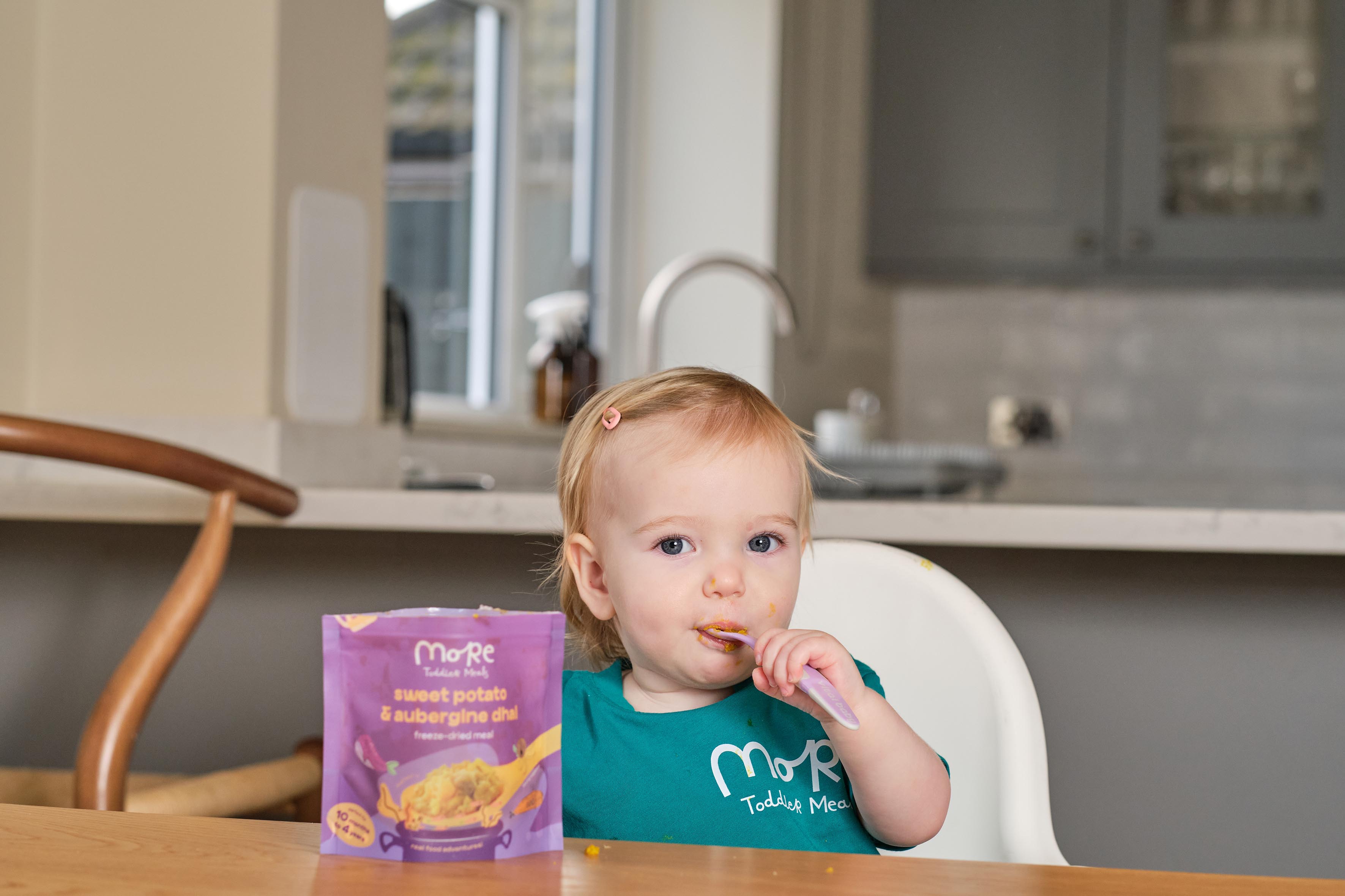 toddler eating a more toddler meal for a quick and healthy meal.